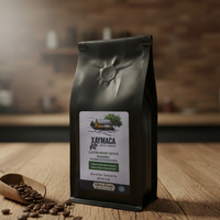 Xaymaca Coffee bag on a wooden surface with coffee beans
