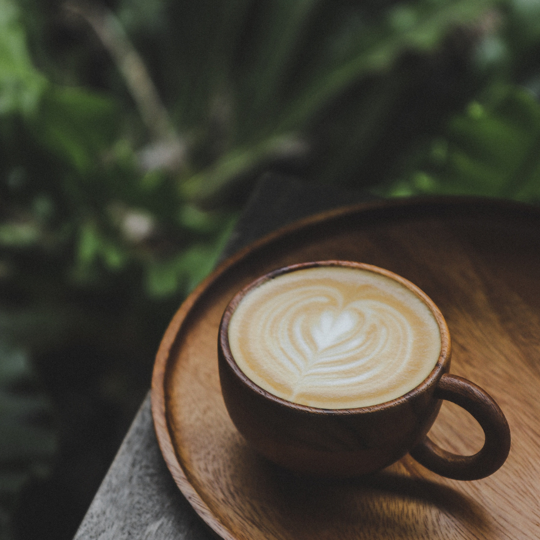 A cup of latte made with freshly roasted Jamaican coffee beans