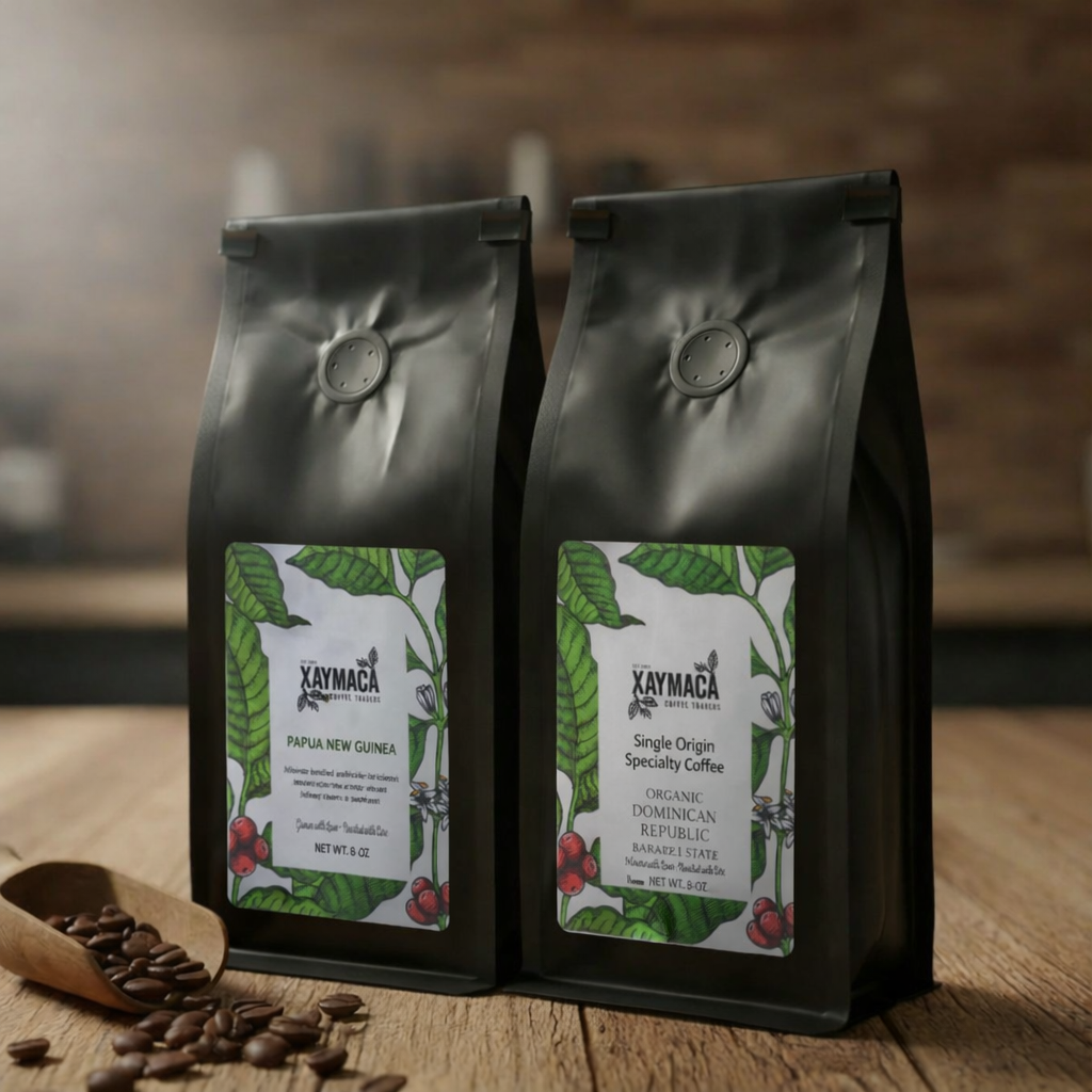 Xaymaca single origin coffee bags from Papua New Guinea and Dominican Republic on a wooden table 