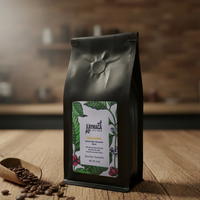 Coffee bag with a label on a wooden surface, with coffee beans around