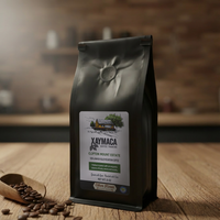 Coffee bag with Xaymaca label on a wooden surface with coffee beans